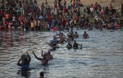 Migrants Wading Across the Rio Grande