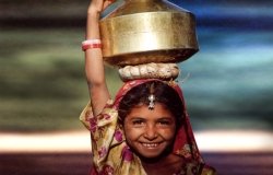Young girl holding water container in Asia 