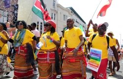 Colourful African campaigners for LGBTI liberation to be recognized with their country’s liberation in West Street during Brighton Pride Parade 2018 in Brighton, East Sussex/UK
