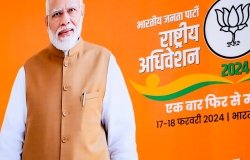A picture of Narendra Modi (Prime Minister of India) against an orange backdrop for a 2024 election campaign.
